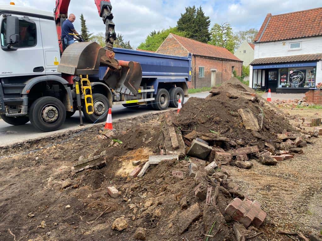 This is a photo of a dig out being carried out for the installation of a new tarmac driveway. Works being carried out by Wickham Market Driveways