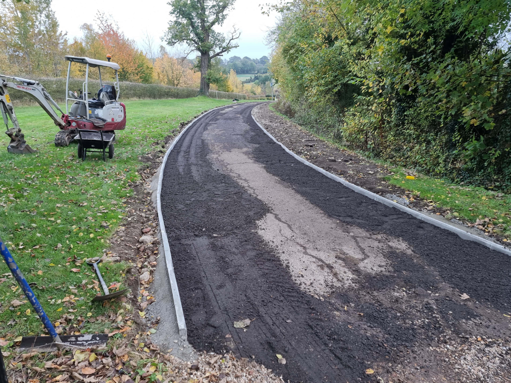 This is a large driveway which is in the process of having a tar and chip driveway installed on by Wickham Market Driveways